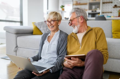 Wood-Financial-Group-happy-romantic-senior-couple-hugging-and-enjoying-retirement-at-home 1